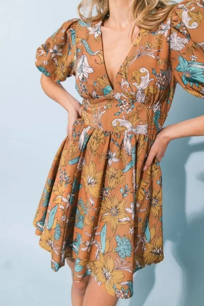 floral mini dress in rust with puff sleeves