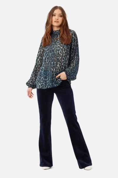 animal print moments top in blue at the boutique