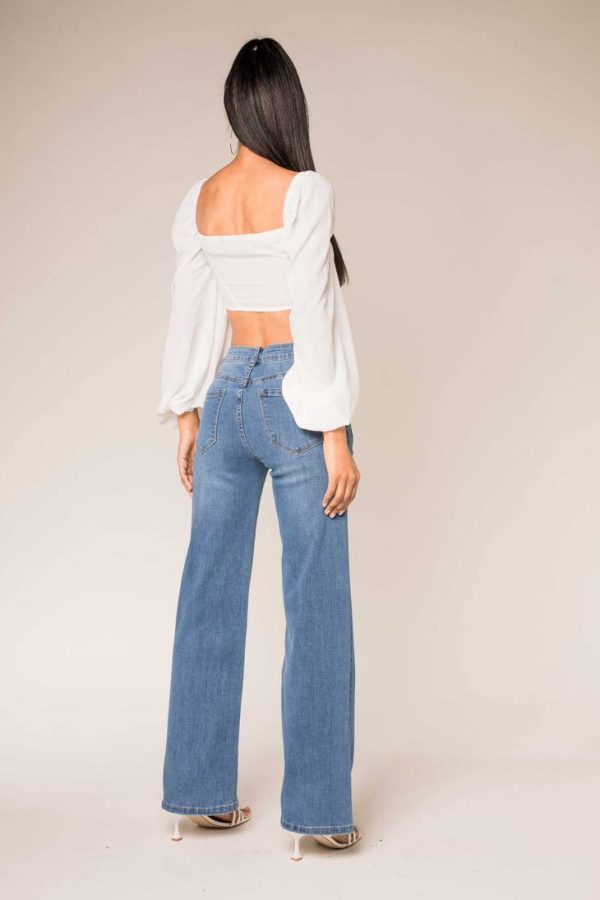 Light denim flared jeans At The Boutique